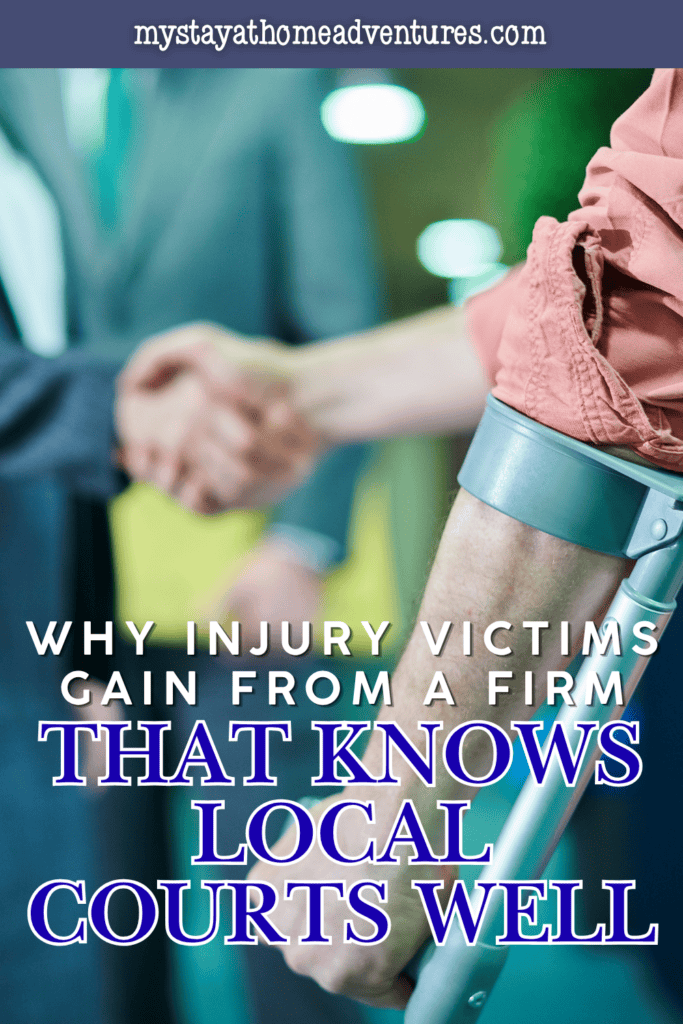 A person using a forearm crutch shakes hands with another person during a meeting about an injury claim.