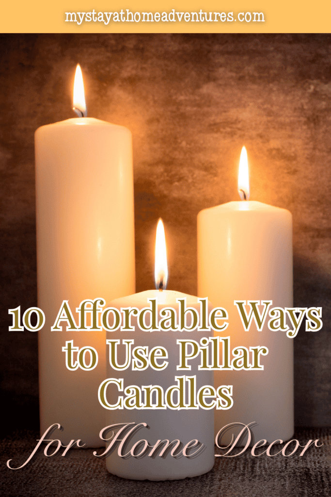 Three ivory pillar candles of different heights burn brightly against a textured brown background, casting a warm glow.