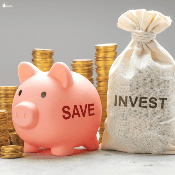 A pink piggy bank, stacked gold coins, and a fabric money bag symbolize financial growth through a high-paying career.
