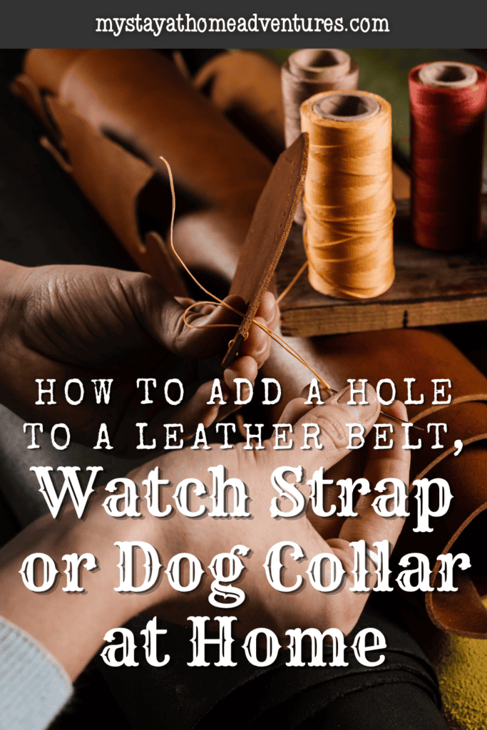 Hands pull golden thread through a hole in a leather strip beside several spools on a wooden table.