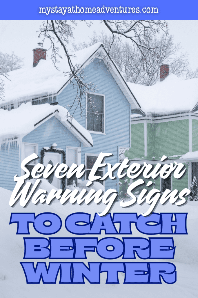 Long icicles hang from snow-covered roof edges, highlighting potential drainage problems during cold weather.