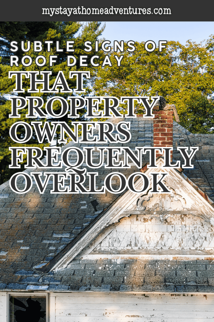 Worn shingles and peeling wooden gable trim highlight visible deterioration on an aging house with roof decay.
